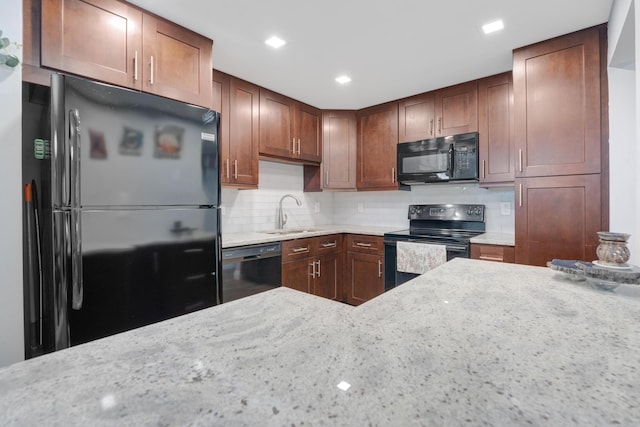 495 SE 8th St Unit 147, Deerfield Beach, FL 33441 - kitchen with black appliances, a sink, light stone countertops, tasteful backsplash, and recessed lighting