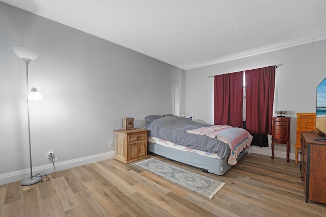 495 SE 8th St Unit 147, Deerfield Beach, FL 33441 - bedroom with light wood-style floors and baseboards