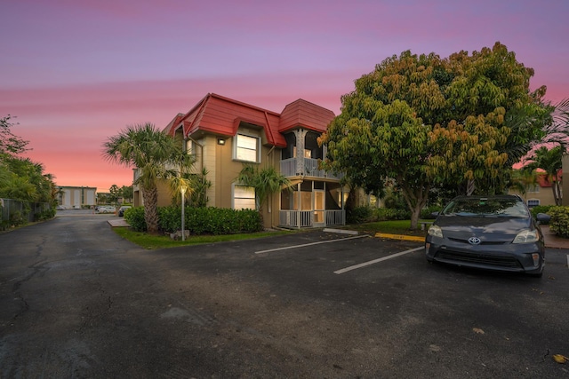 495 SE 8th St Unit 147, Deerfield Beach, FL 33441 - property at dusk featuring uncovered parking