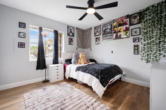 495 SE 8th St Unit 147, Deerfield Beach, FL 33441 - bedroom featuring wood finished floors, baseboards, and a ceiling fan