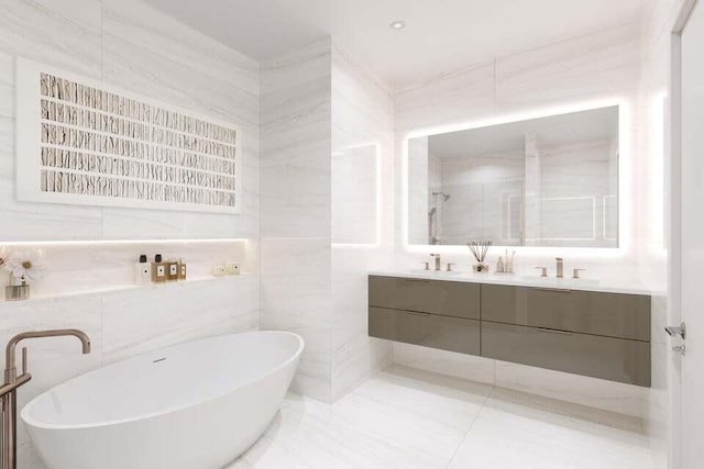 318 SE 5th Ave Unit A 301, Delray Beach, FL 33483 - bathroom with a freestanding bath, double vanity, tile walls, and a shower