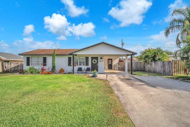 3314 Plaza Pl, Lake Worth, FL 33462 - view of front of property featuring concrete driveway, stucco siding, and a carport
