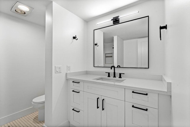 1111 S Ocean Blvd Unit 313, Boca Raton, FL 33432 - bathroom with baseboards, toilet, and vanity