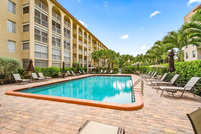 1111 S Ocean Blvd Unit 313, Boca Raton, FL 33432 - community pool featuring a patio