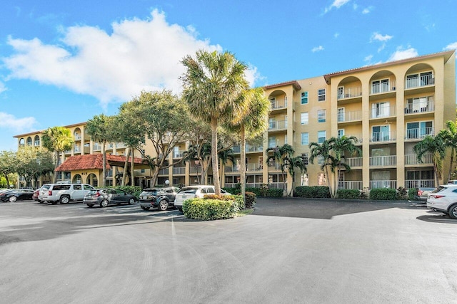 1111 S Ocean Blvd Unit 313, Boca Raton, FL 33432 - view of apartment building / complex featuring uncovered parking