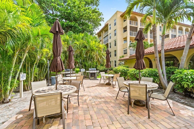 1111 S Ocean Blvd Unit 313, Boca Raton, FL 33432 - view of patio featuring outdoor dining area and grilling area