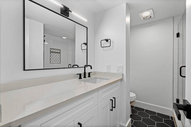 1111 S Ocean Blvd Unit 313, Boca Raton, FL 33432 - full bath with a shower stall, toilet, tile patterned flooring, and vanity