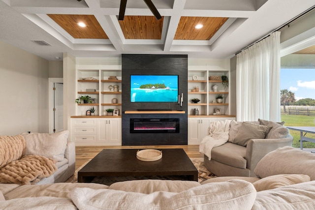 18102 Bridle Way, Port Saint Lucie, FL 34987 - living area with light wood-type flooring, coffered ceiling, a fireplace, beamed ceiling, and built in shelves