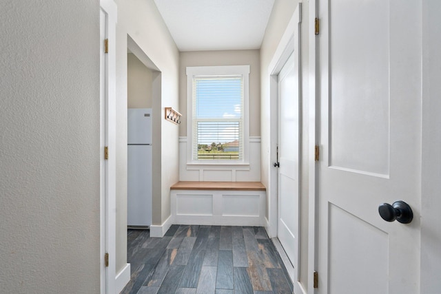 18102 Bridle Way, Port Saint Lucie, FL 34987 - corridor featuring dark wood finished floors and wainscoting