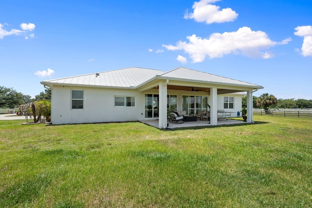 18102 Bridle Way, Port Saint Lucie, FL 34987 - rear view of property with ceiling fan, an outdoor living space, a patio, metal roof, and stucco siding
