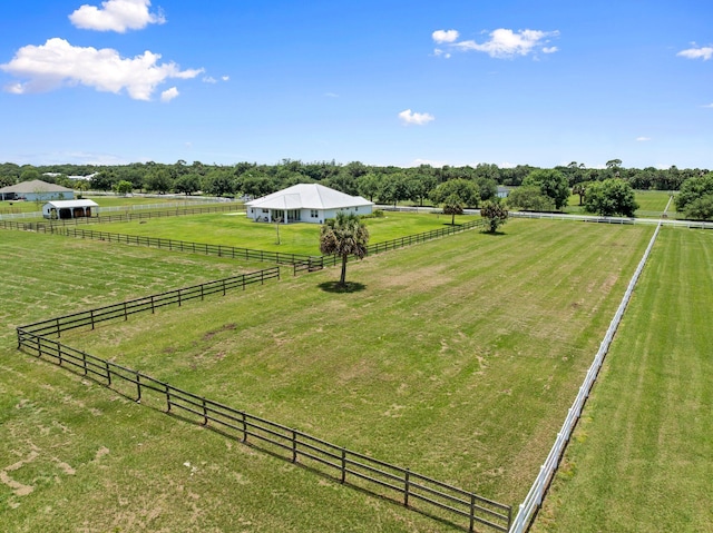 18102 Bridle Way, Port Saint Lucie, FL 34987 - view of yard with a view of countryside, an outdoor structure, an exterior structure, and an outbuilding