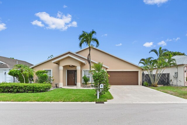 1184 Landings Run, Greenacres, FL 33413 - ranch-style home featuring stucco siding, a garage, and concrete driveway