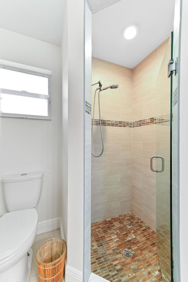 1184 Landings Run, Greenacres, FL 33413 - bathroom with a shower stall, toilet, and baseboards