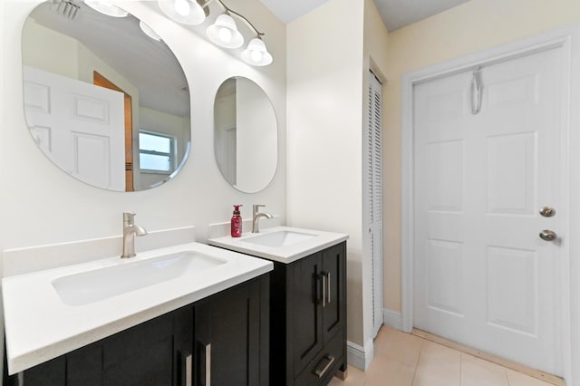 1184 Landings Run, Greenacres, FL 33413 - bathroom with two vanities, tile patterned floors, and a closet