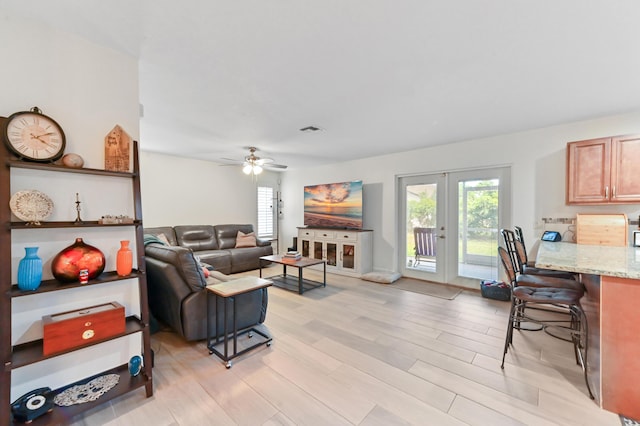 1184 Landings Run, Greenacres, FL 33413 - living room featuring light wood-style floors, french doors, and a ceiling fan