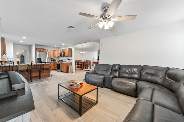 1184 Landings Run, Greenacres, FL 33413 - living room with a ceiling fan, recessed lighting, and light wood finished floors