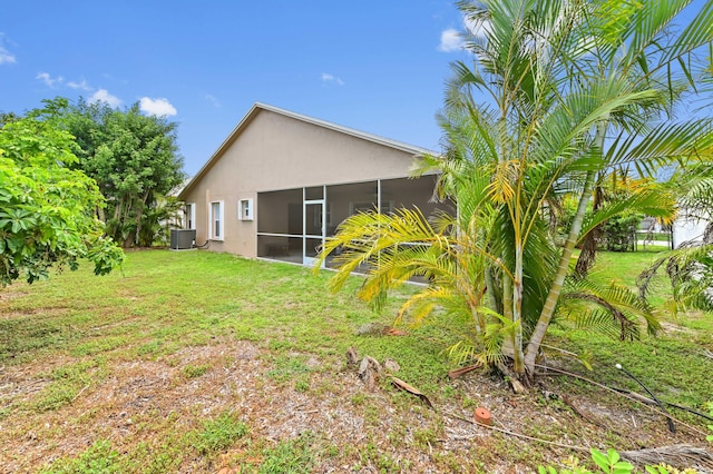 1184 Landings Run, Greenacres, FL 33413 - view of grassy yard featuring a sunroom and central air condition unit