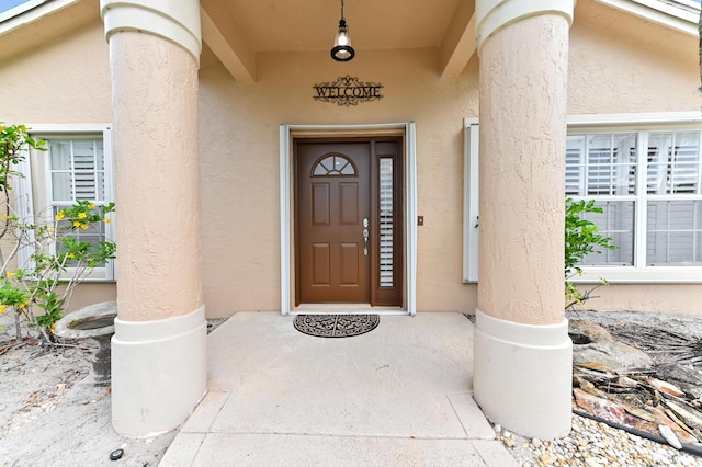 1184 Landings Run, Greenacres, FL 33413 - view of exterior entry featuring stucco siding