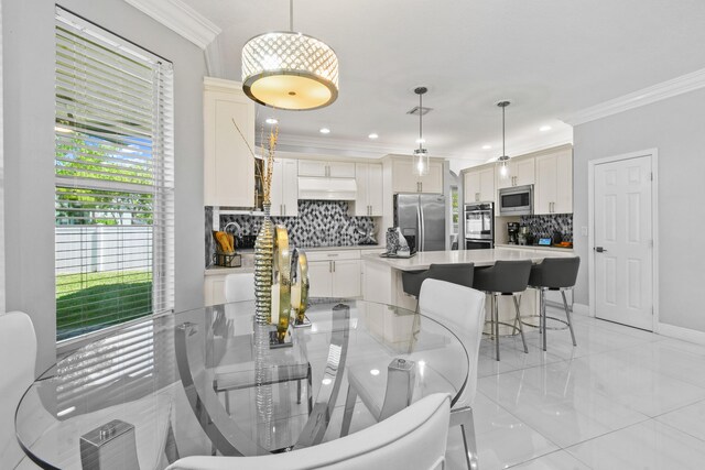 2371 Simonson Dr, Wellington, FL 33414 - dining space featuring ornamental molding, recessed lighting, and baseboards