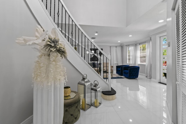 2371 Simonson Dr, Wellington, FL 33414 - stairway featuring tile patterned floors, recessed lighting, ornamental molding, and baseboards