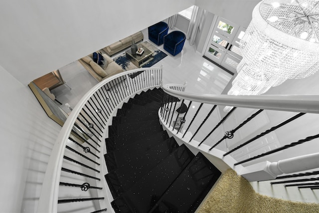 2371 Simonson Dr, Wellington, FL 33414 - stairs with a chandelier, french doors, and a high ceiling