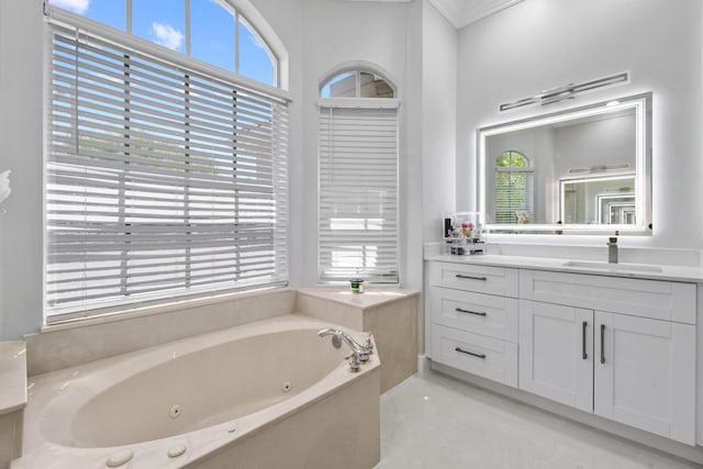 2371 Simonson Dr, Wellington, FL 33414 - full bathroom featuring a jetted tub, vanity, and ornamental molding