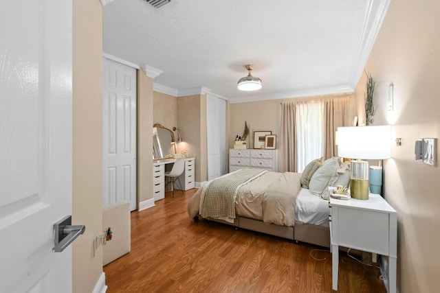 2371 Simonson Dr, Wellington, FL 33414 - bedroom featuring ornamental molding and wood finished floors