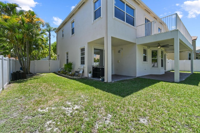 2371 Simonson Dr, Wellington, FL 33414 - back of house with a ceiling fan, a balcony, a patio, and stucco siding