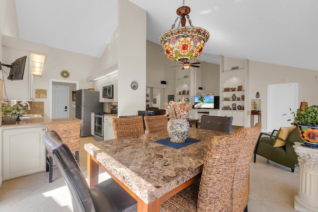 2855 Eagle Ln, West Palm Beach, FL 33409 - dining space featuring high vaulted ceiling, a ceiling fan, light tile patterned floors, and built in shelves