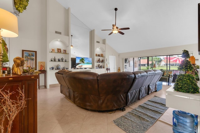 2855 Eagle Ln, West Palm Beach, FL 33409 - living area featuring high vaulted ceiling, ceiling fan, light tile patterned floors, and built in shelves
