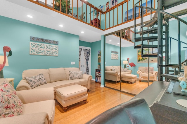 2855 Eagle Ln, West Palm Beach, FL 33409 - living room with stairway, wood finished floors, a high ceiling, and recessed lighting