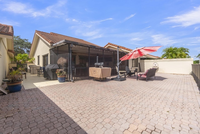 2855 Eagle Ln, West Palm Beach, FL 33409 - back of house featuring a tile roof, a patio, stucco siding, and fence