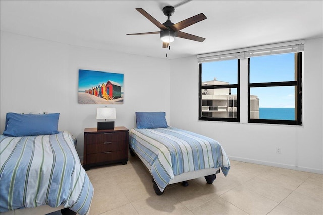 2800 N Ocean Dr Unit B-24D, Singer Island, FL 33404 - bedroom featuring tile patterned flooring, a ceiling fan, and baseboards
