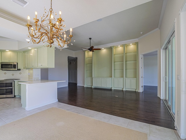 5151 Formosa Cir, Vero Beach, FL 32967 - kitchen featuring appliances with stainless steel finishes, crown molding, light tile patterned floors, a chandelier, and ceiling fan