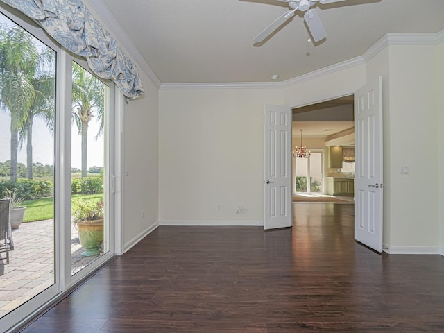 5151 Formosa Cir, Vero Beach, FL 32967 - empty room with dark wood-style flooring, crown molding, baseboards, ceiling fan, and a chandelier