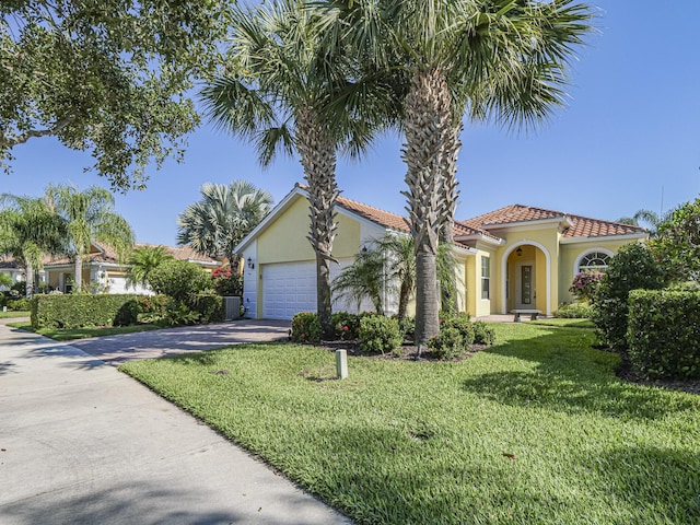 5151 Formosa Cir, Vero Beach, FL 32967 - view of front of house featuring stucco siding, driveway, a tiled roof, a front lawn, and a garage