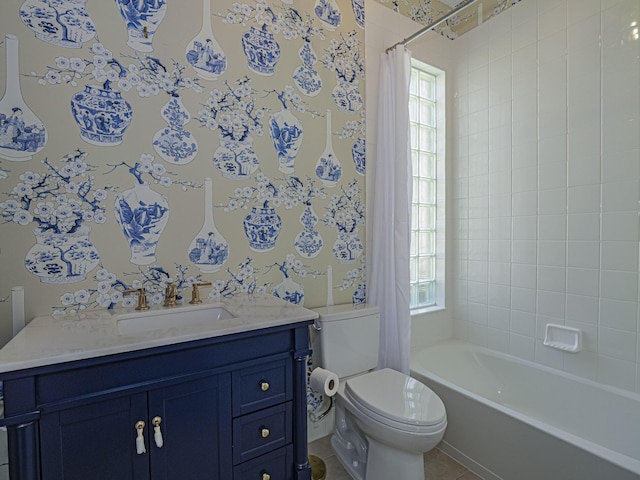 5151 Formosa Cir, Vero Beach, FL 32967 - bathroom with plenty of natural light, toilet, vanity, and shower / bath combo with shower curtain
