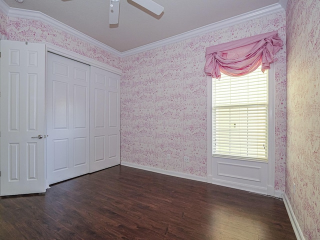 5151 Formosa Cir, Vero Beach, FL 32967 - unfurnished bedroom featuring wallpapered walls, crown molding, dark wood-style flooring, a closet, and a ceiling fan