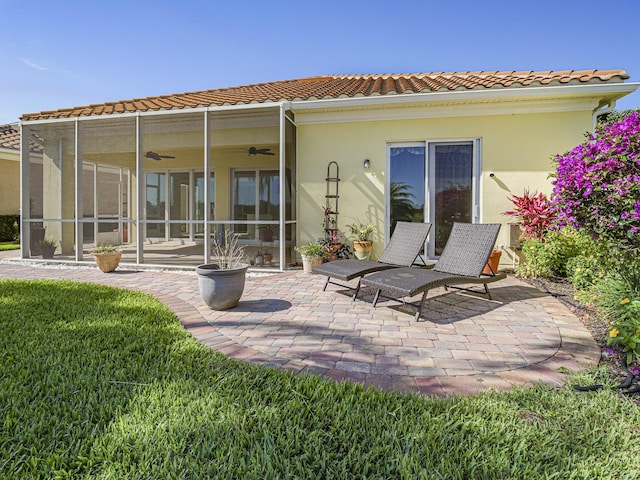 5151 Formosa Cir, Vero Beach, FL 32967 - rear view of property with a ceiling fan, a patio, a tiled roof, and stucco siding