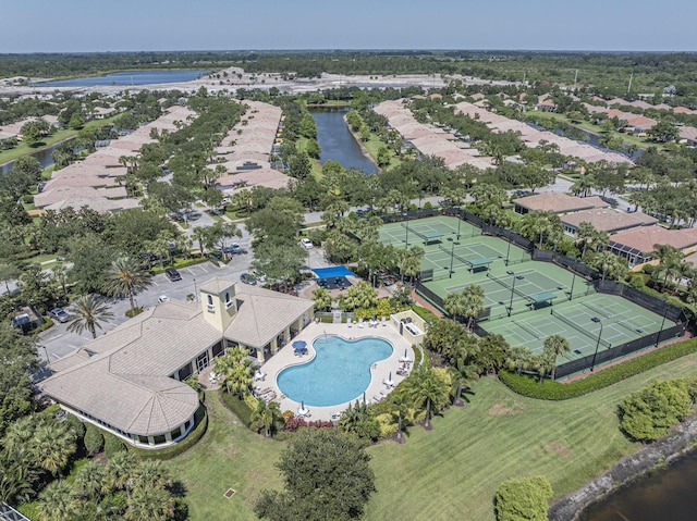 5151 Formosa Cir, Vero Beach, FL 32967 - aerial view of property and surrounding area with a pool area, a large body of water, and nearby suburban area