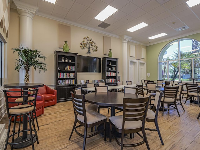 5151 Formosa Cir, Vero Beach, FL 32967 - dining space featuring ornate columns, crown molding, and light wood-type flooring
