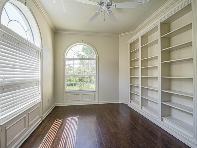 5151 Formosa Cir, Vero Beach, FL 32967 - unfurnished room featuring built in shelves, dark wood-style floors, ceiling fan, baseboards, and ornamental molding