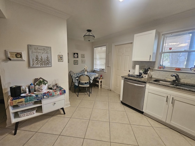 2018 S 10th St Unit C, Fort Pierce, FL 34950 - kitchen with stainless steel dishwasher, a sink, crown molding, dark stone countertops, and white cabinets
