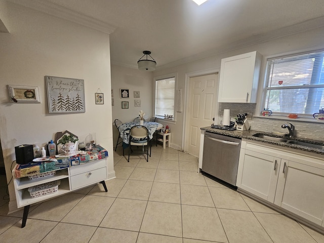 2018 S 10th St Unit C, Fort Pierce, FL 34950 - kitchen featuring stainless steel dishwasher, a sink, crown molding, dark stone counters, and white cabinets