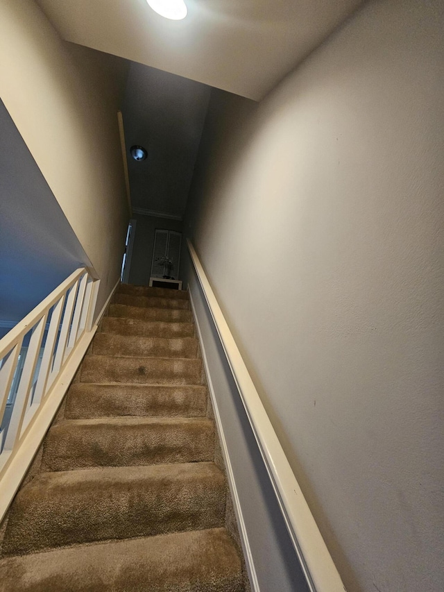 2018 S 10th St Unit C, Fort Pierce, FL 34950 - stairway featuring carpet floors