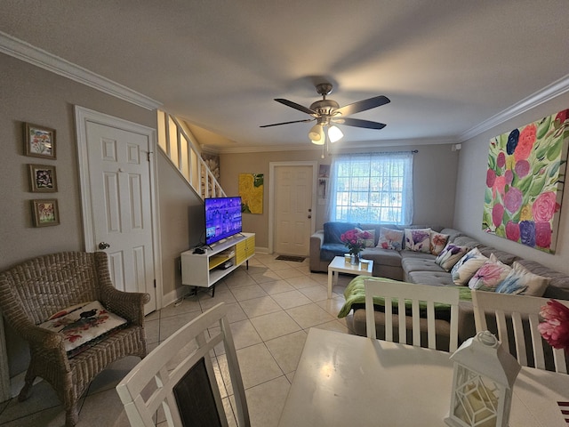 2018 S 10th St Unit C, Fort Pierce, FL 34950 - living area featuring light tile patterned floors, ornamental molding, ceiling fan, and baseboards