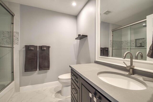 6 E Lexington Ln Unit C, Palm Beach Gardens, FL 33418 - bathroom featuring vanity, toilet, marble look tiles, baseboards, and recessed lighting