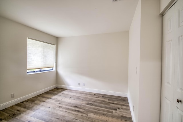 6 E Lexington Ln Unit C, Palm Beach Gardens, FL 33418 - spare room with wood finished floors and baseboards