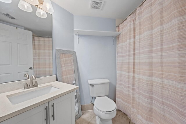 4179 N Haverhill Rd Unit 609, West Palm Beach, FL 33417 - bathroom featuring toilet, vanity, and tile patterned floors
