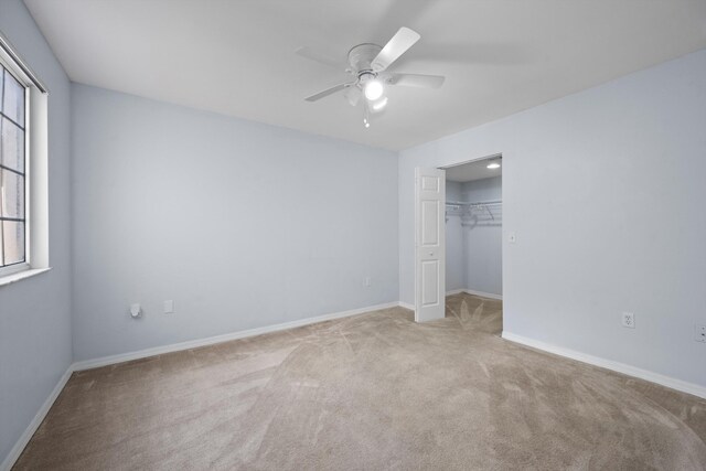 4179 N Haverhill Rd Unit 609, West Palm Beach, FL 33417 - unfurnished bedroom with carpet, multiple windows, and baseboards